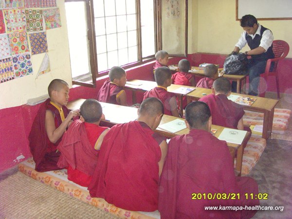 The new teacher educates the kids in english, health and hygiene