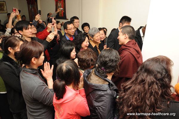 Karmapa is welcomed by the members of the centre