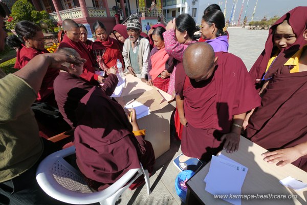 KIBS Rinpoches monks and nuns running the registration desk/weight verifying